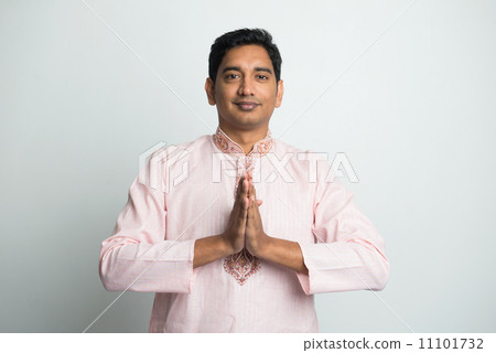 traditional young indian male with Pranamasana greetings sign on 11101732