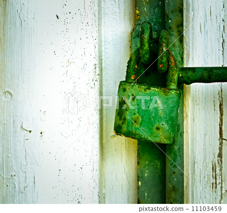old green rusty iron padlock 11103459