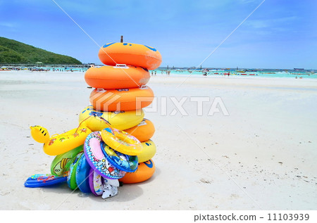 Stack of colorful swimming tubes on the beach Stack of colorful swimming tubes on the beach 11103939