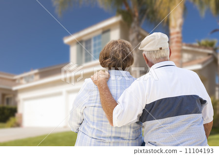 Happy Senior Couple Looking at Front of House 11104193