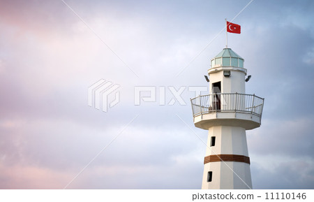 Upper part of white Lighthouse with Turkish flag on top. Avsallar, Alanya, Turkey Upper part of white Lighthouse with Turkish flag on top. Avsallar, Alanya, Turkey 11110146