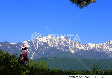 A woman enjoying the northern alps of snowfall and hiking 11112306