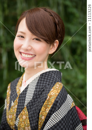 A woman in a kimono A woman in a kimono 11113226