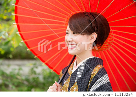 A woman in a kimono A woman in a kimono 11113284