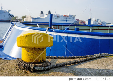 Bollard at a pier with ferry 11114192