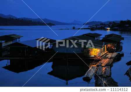 House raft on the river at night 11114312