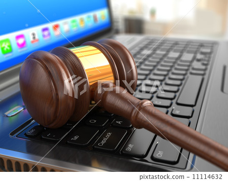 Online internet auction. Gavel on laptop. 11114632