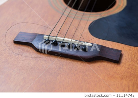 Close up of guitar with torn string 11114742