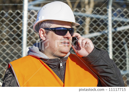 Engineer with the cell phone Engineer with the cell phone 11117715