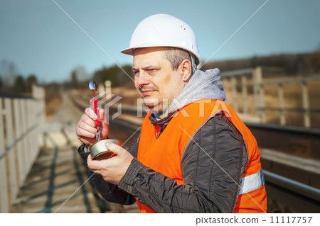 Worker with canned meat Worker with canned meat 11117757