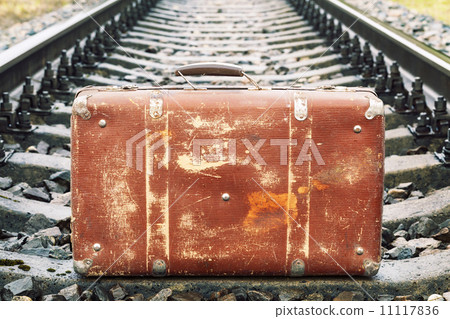 Suitcase on the railway 11117836