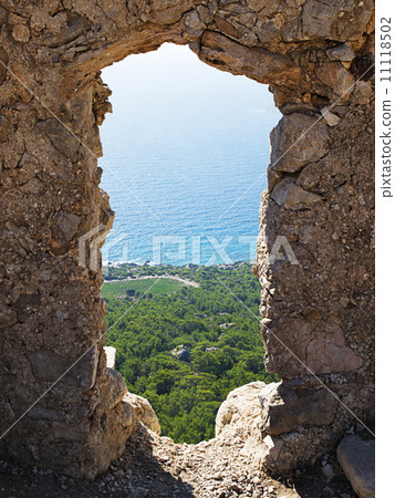 View through the wall opening of Monolithos castle. View through the wall opening of Monolithos castle. 11118502