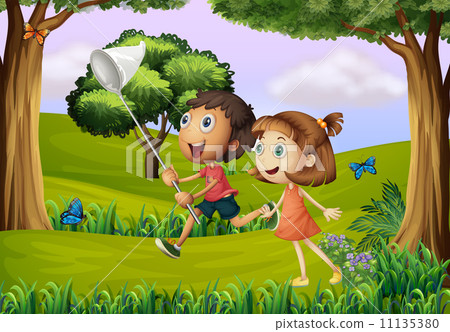 Two kids playing at the forest with a net Two kids playing at the forest with a net 11135380