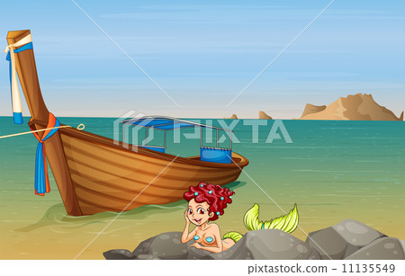 A mermaid at the sea near the wooden boat A mermaid at the sea near the wooden boat 11135549