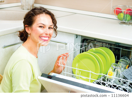Dishwasher. Happy Young Woman in the Kitchen doing Housework 11136604