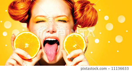Beauty joyful teen girl with juicy oranges. Freckles 11136633