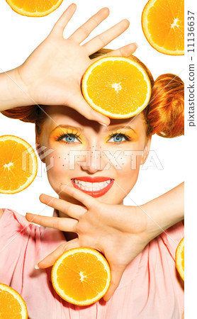 Beauty model girl takes juicy oranges. Freckles 11136637