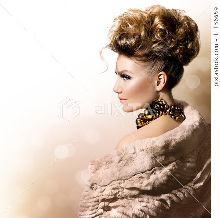 Beautiful model girl in luxury fur coat 11136659