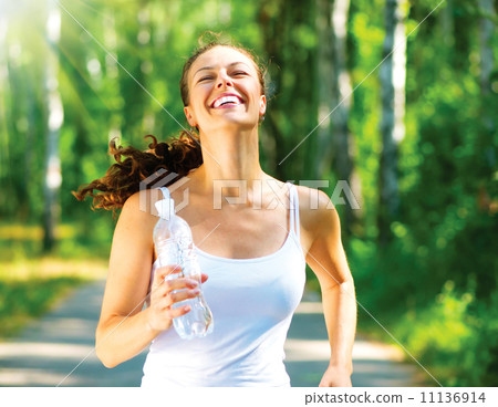 Running woman. Female Runner Jogging in a Park 11136914