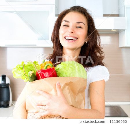 Happy Young Woman with Vegetables in Shopping Bag. Diet Concept 11136960
