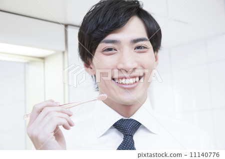 Toothbrushing businessman 11140776