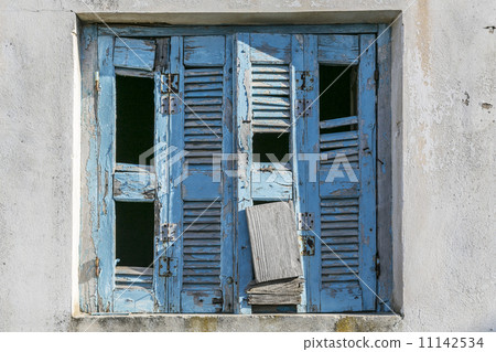 very old and damaged blue shutter 11142534