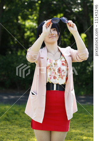 School girls taking sunglasses in the park School girls taking sunglasses in the park 11143246