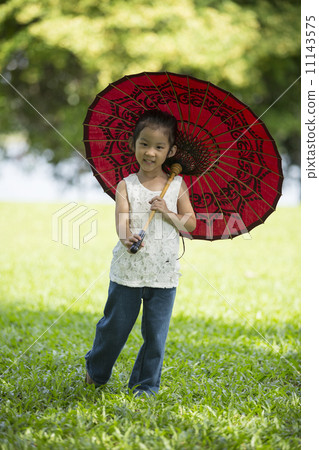 Little asian girl with traditional Asian umbrella. Little asian girl with traditional Asian umbrella. 11143575