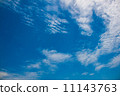 blue sky with tiny clouds 11143763