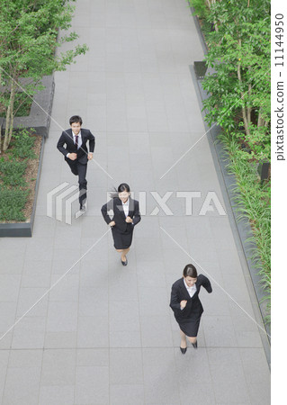 Running businessman and business woman 11144950