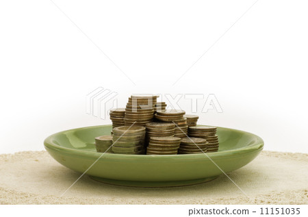 Stack of coin in green plate Stack of coin in green plate 11151035