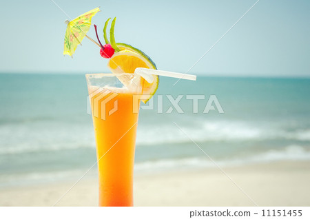 Tequila sunrise cocktail with fruits and umbrella decoration Tequila sunrise cocktail with fruits and umbrella decoration 11151455