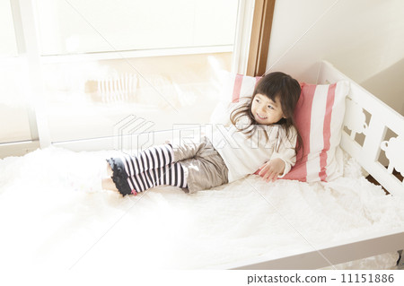 A girl sleeping in bed A girl sleeping in bed 11151886