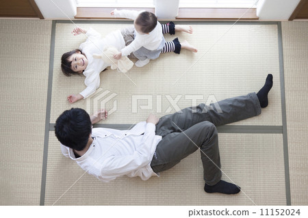 A family lying down in a Japanese style room 11152024