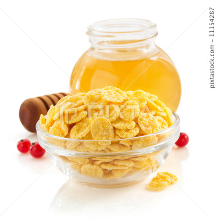 corn flakes in bowl on white 11154287