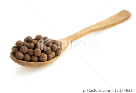 allspice in spoon  on white 11154628