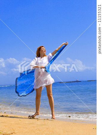 The young beautiful woman on an ocean coast. Indonesia. Bali... 11155321