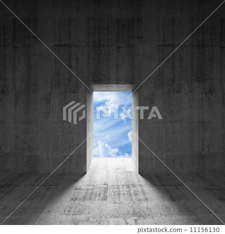 Abstract dark concrete interior with sky behind glowing door 11156130