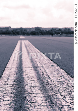 worms eye vintage shoot of a road marking on an airstrip 11156321