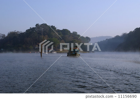 Boat on forest lake, Periyar National Park, Kerala, India Boat on forest lake, Periyar National Park, Kerala, India 11156690