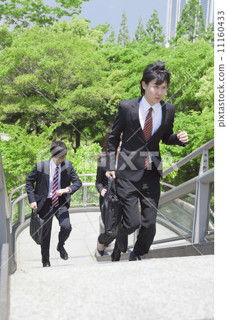 Businessman and Businesswoman climbing stairs Businessman and Businesswoman climbing stairs 11160433