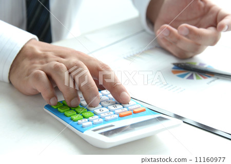 Businessman using a calculator Businessman using a calculator 11160977
