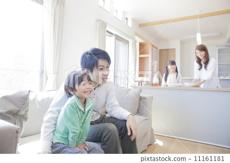 A family relaxing in the living room A family relaxing in the living room 11161181