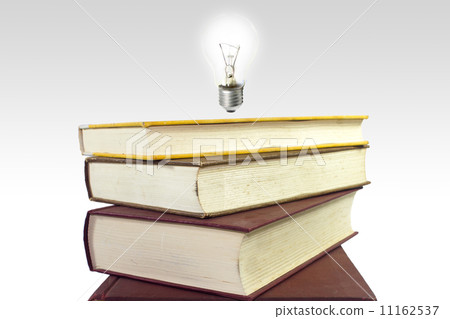 Stack of books with light bulb. Wisdom and Knowledge Concept Stack of books with light bulb. Wisdom and Knowledge Concept 11162537