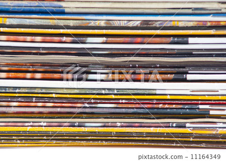 stack of colorful magazines or documents - paper edges background stack of colorful magazines or documents - paper edges background 11164349