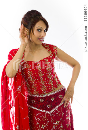 Young Indian woman trying to listen 11166404