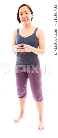 Young woman smiling with hands clasped 11166432