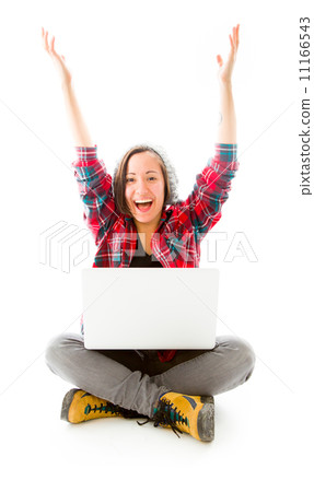 Young man using laptop with arms raised 11166543