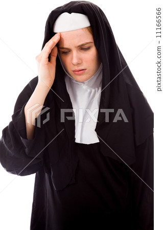 Young nun suffering from headache Young nun suffering from headache 11166566