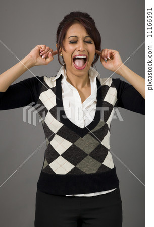 Indian businesswoman shouting with hands in ear 11166591